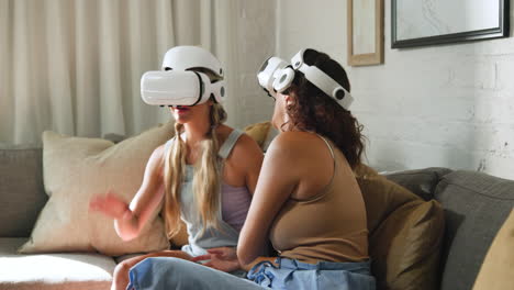 diverse female friends enjoying virtual reality experience on couch, interacting with vr headsets
