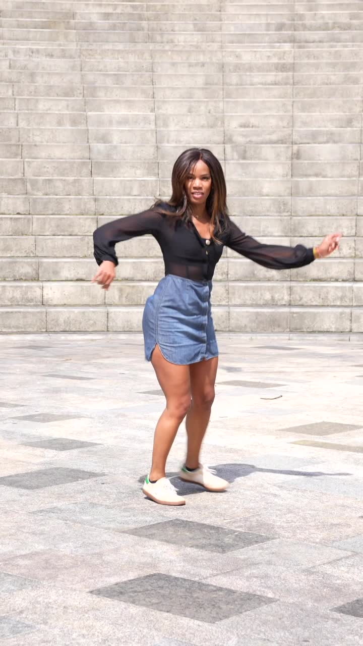 Woman dancing near stairs