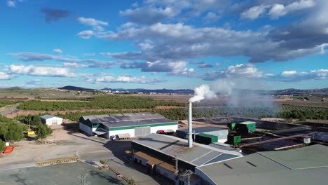 factory emites smoke pollution contamination on a windy day in spain