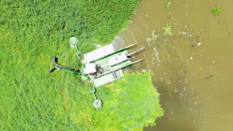 Water-cleaner-machine-cleaning-Ozama-river,-Dominican-Republic