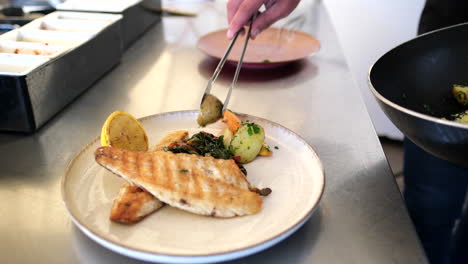 a perfectly grilled fish fillet with roasted veggies and a lemon twist