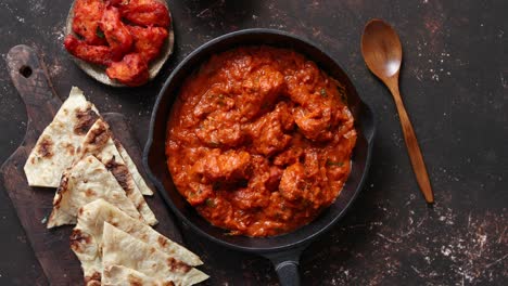 Traditional-Indian-chicken-tikka-masala-spicy-curry-meat-food-in-cast-iron-pan