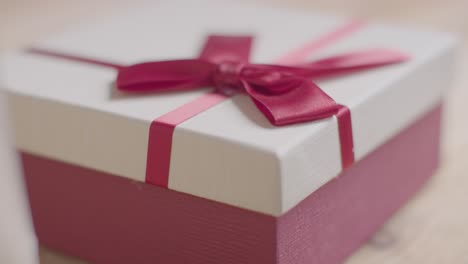 Close-Up-Of-Romantic-Valentines-Present-In-Gift-Wrapped-Box-On-Table-2