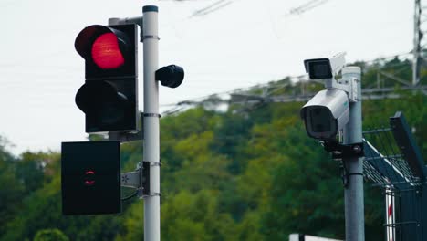 Vehicle-recognition-system-with-traffic-lights-in-an-industrial-plant,-with-nature-in-the-background