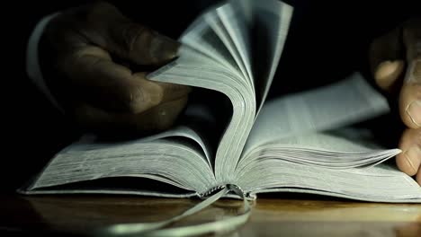 praying-to-god-with-bible-on-table-with-people-stock-video-stock-footage