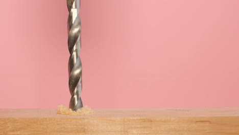 drill bit drilling into wood