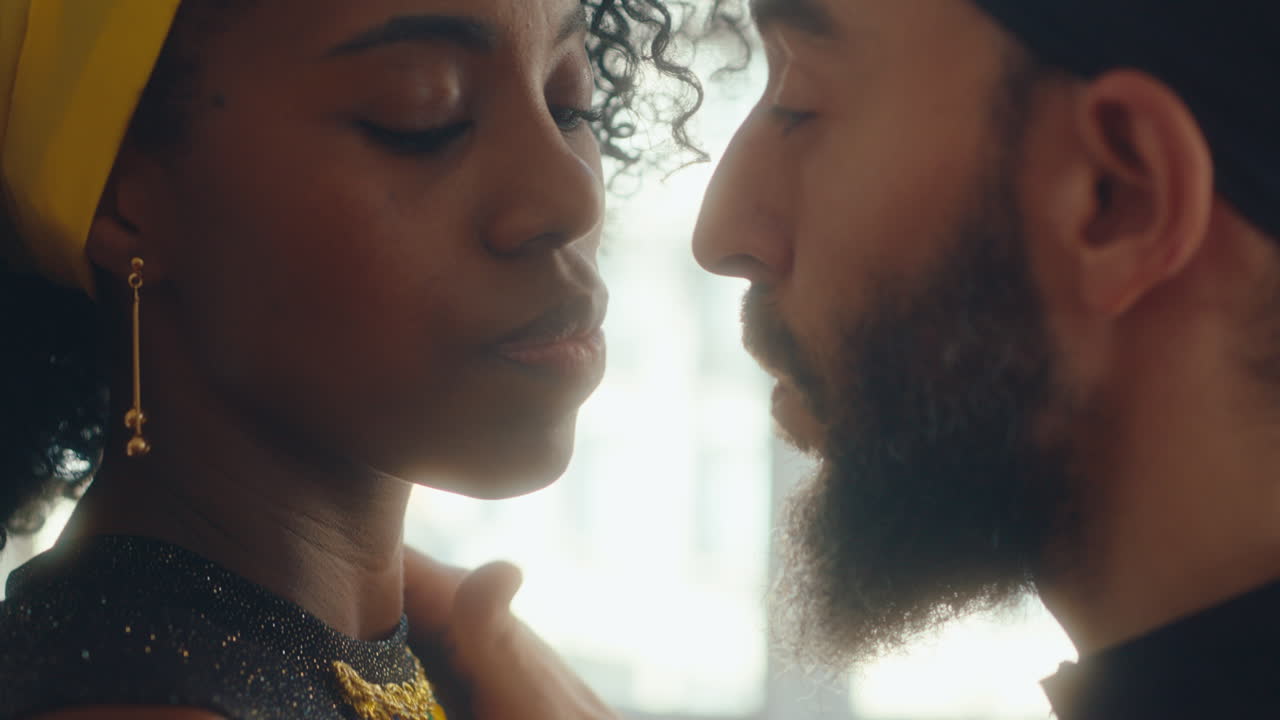 Passionate Couple Looking at Each Other with Desire during Tango Dance