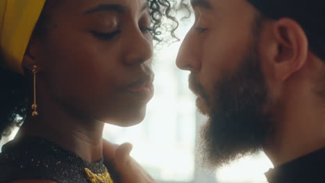 passionate couple looking at each other with desire during tango dance