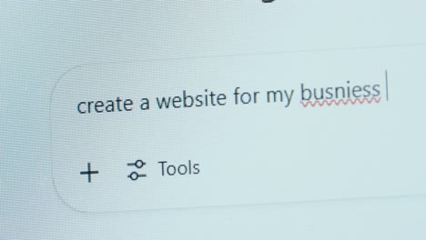 a user types “create a website for my busniess” into an ai chatbot, showing a spelling mistake—highlighting growing dependence on ai and declining attention to detail