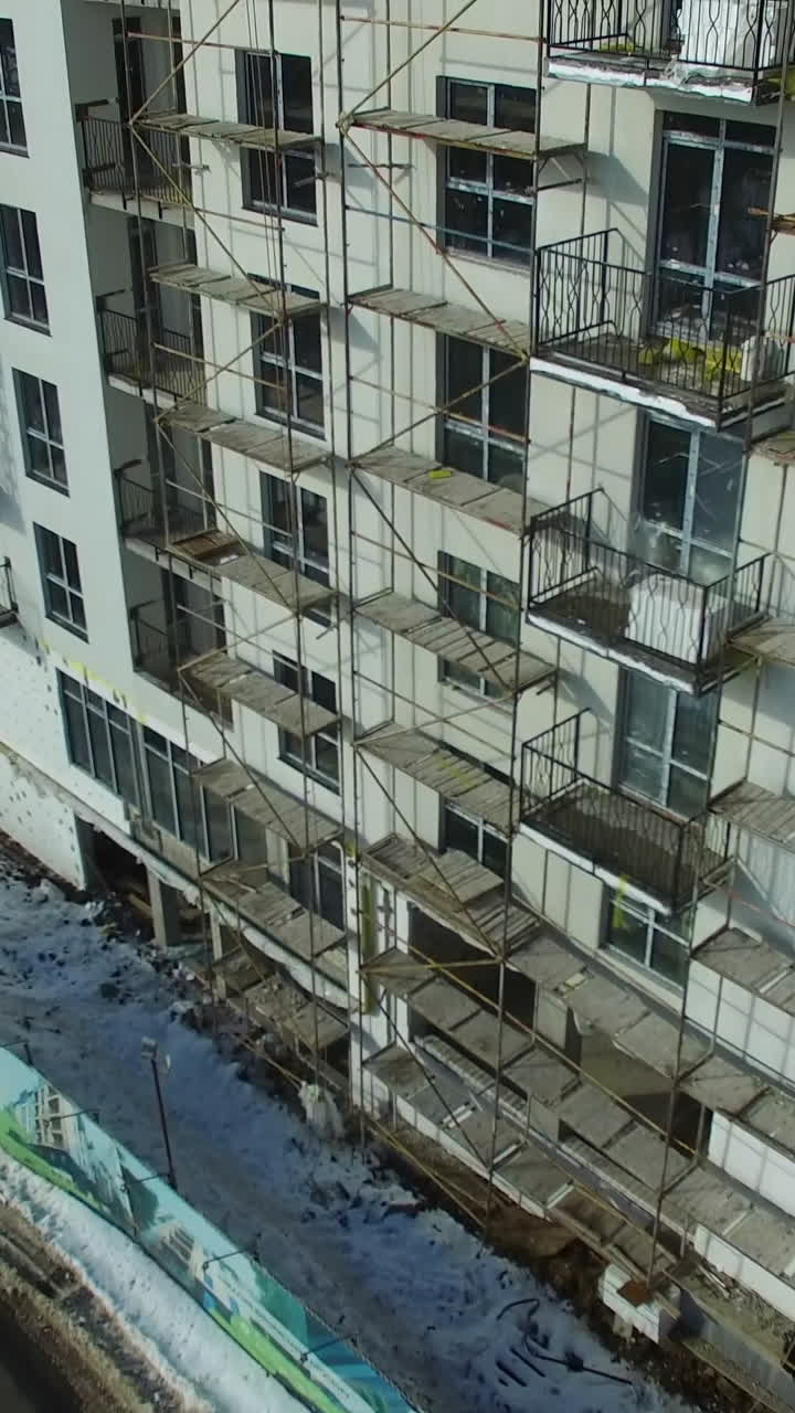 Construction crane and skyscraper. Building under construction in a new residential area