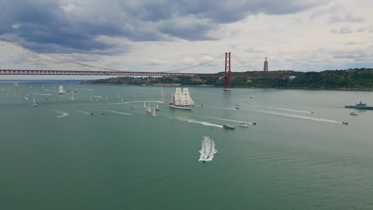 Lisboa cityscape floating yachts at cloudy day drone shot. Many boats sailing