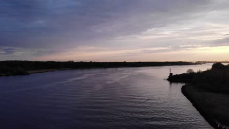 serenity of nature with empty waterway near barendrecht, netherlands at dawn