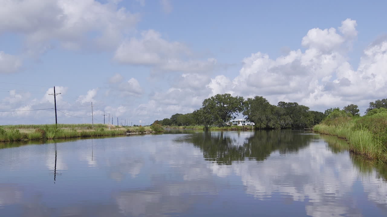 A lake in Terrebonne Parish Louisiana River. Clouds reflecting off the water