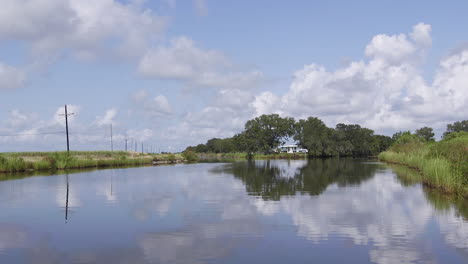 a lake in terrebonne parish louisiana river. clouds reflecting off the water