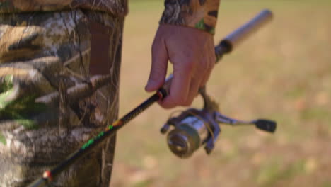 man walking with fishing rod. high speed-slow motion