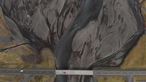 aerial shot of a road crossing glacial river system