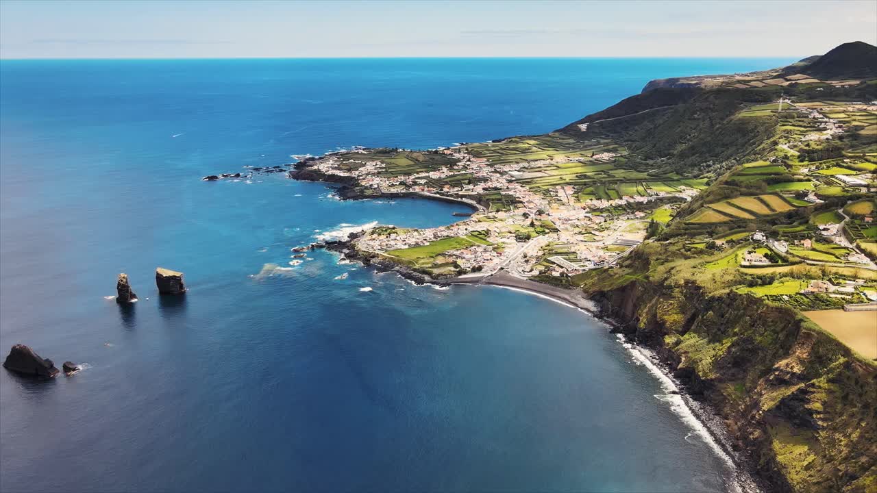 Aerial drone footage showcasing a coastline with dramatic cliffs and blue ocean