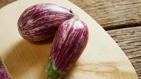 Two-eggplant-on-chopping-board-4k