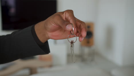 man holding house keys