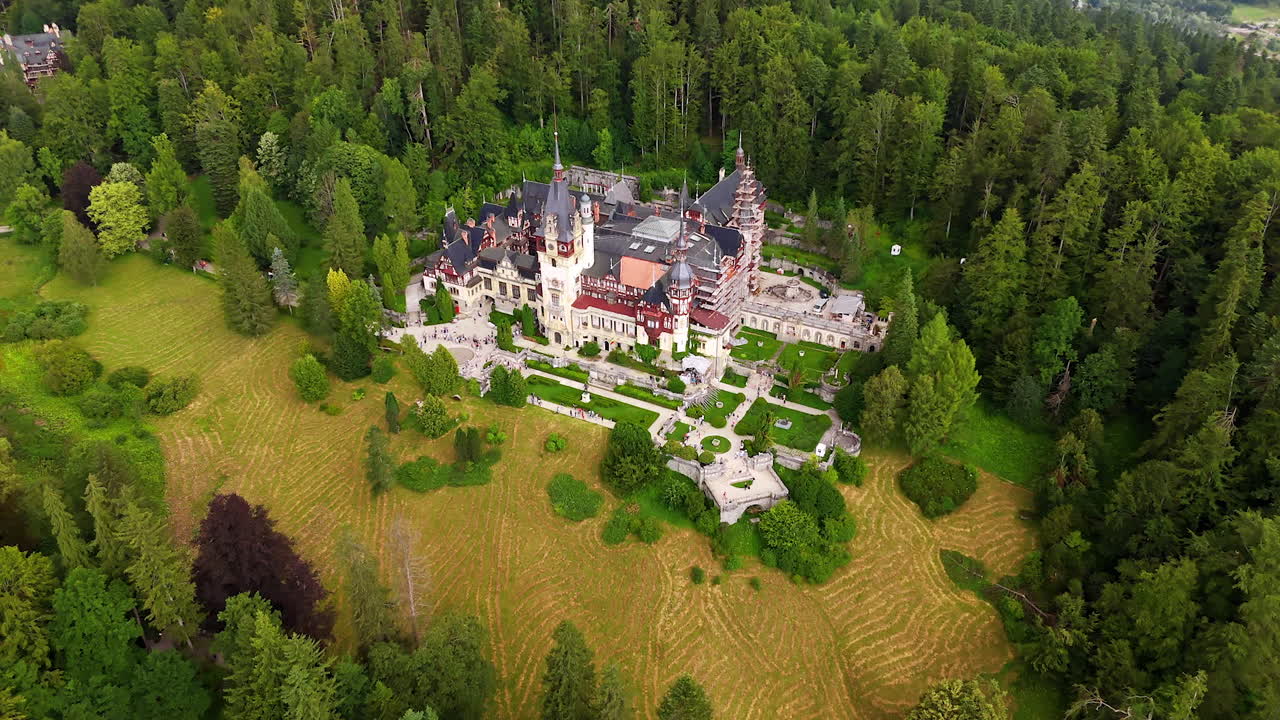 48 Approaching the territory of a beautiful Neo-Renaissance palace located in the mountains. The Peles Castle in Sinaia, the Carpathians, Romania