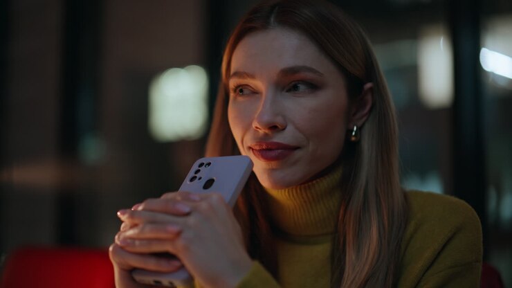 Woman messaging smartphone dark apartment closeup. Portrait business lady