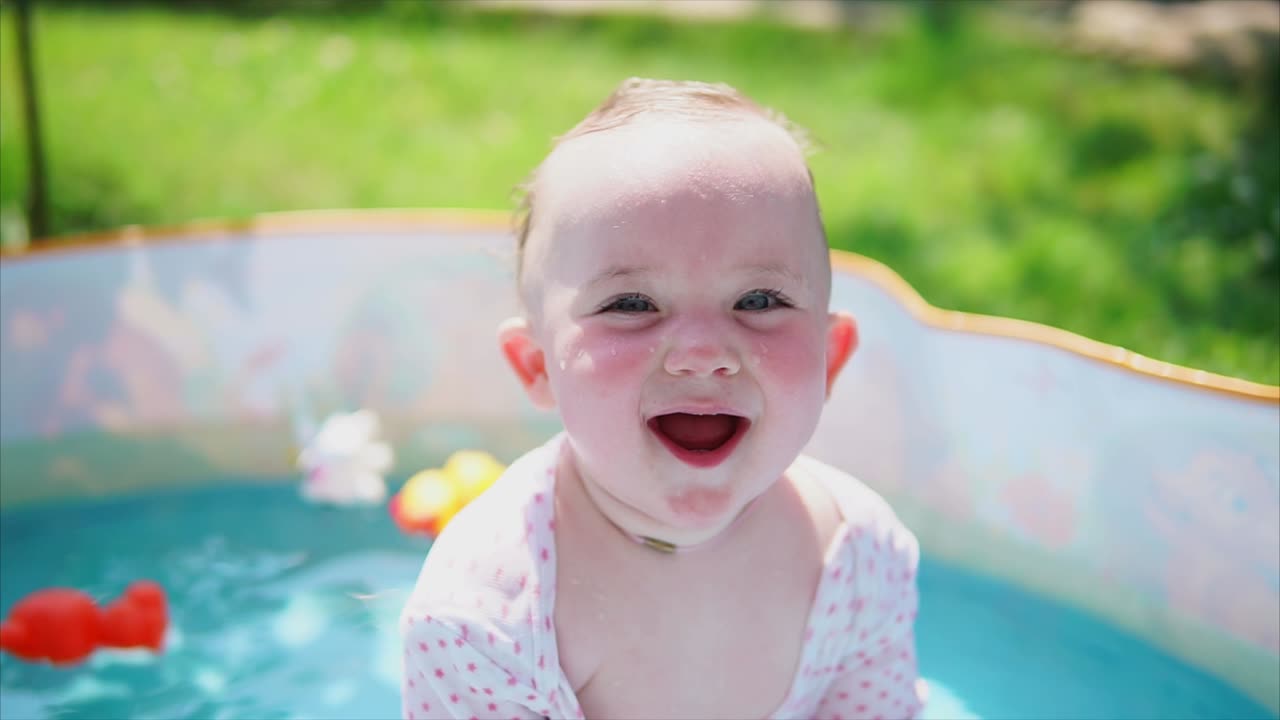 Baby Girl Playing in a Pool