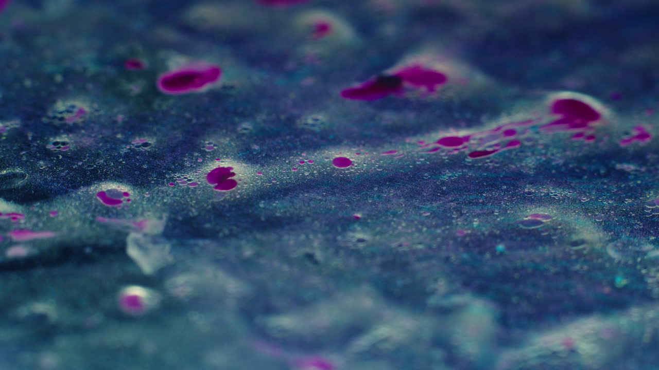 Colourful, organic, liquids macro shots buzzing and flowing