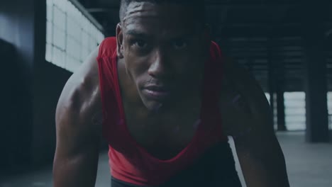 animation of blue trails over african american sportsman at gym