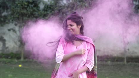 indian girl enjoying holi with colors in her hair