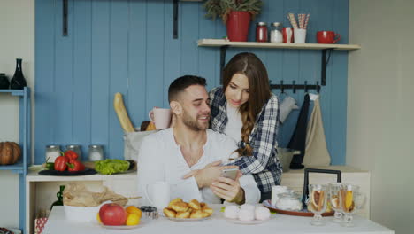 couple enjoying breakfast together in the kitchen