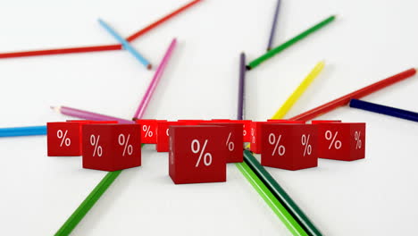 animation of percent sales symbol on red cubes and colour pencils on white background