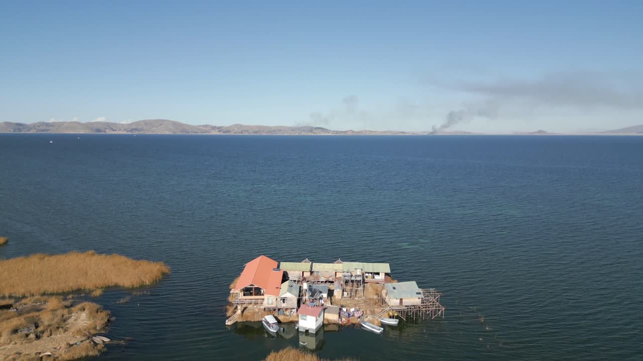 Aerial view of Uros Floating Islands on Lake Titicaca, the highest navigable lake in the world, on the border of Peru and Bolivia, South America