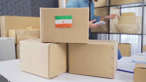 iran flag on logistic cargo package.