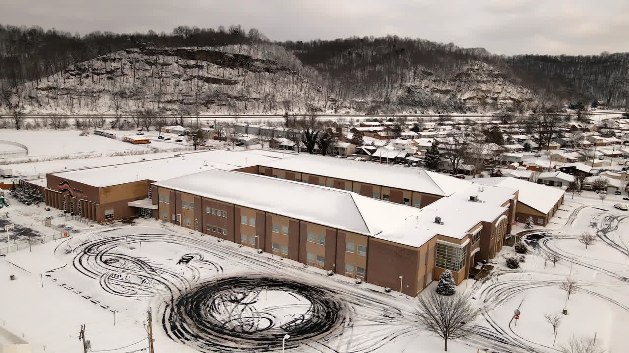 Aerial view of school covered in snow during winter holiday