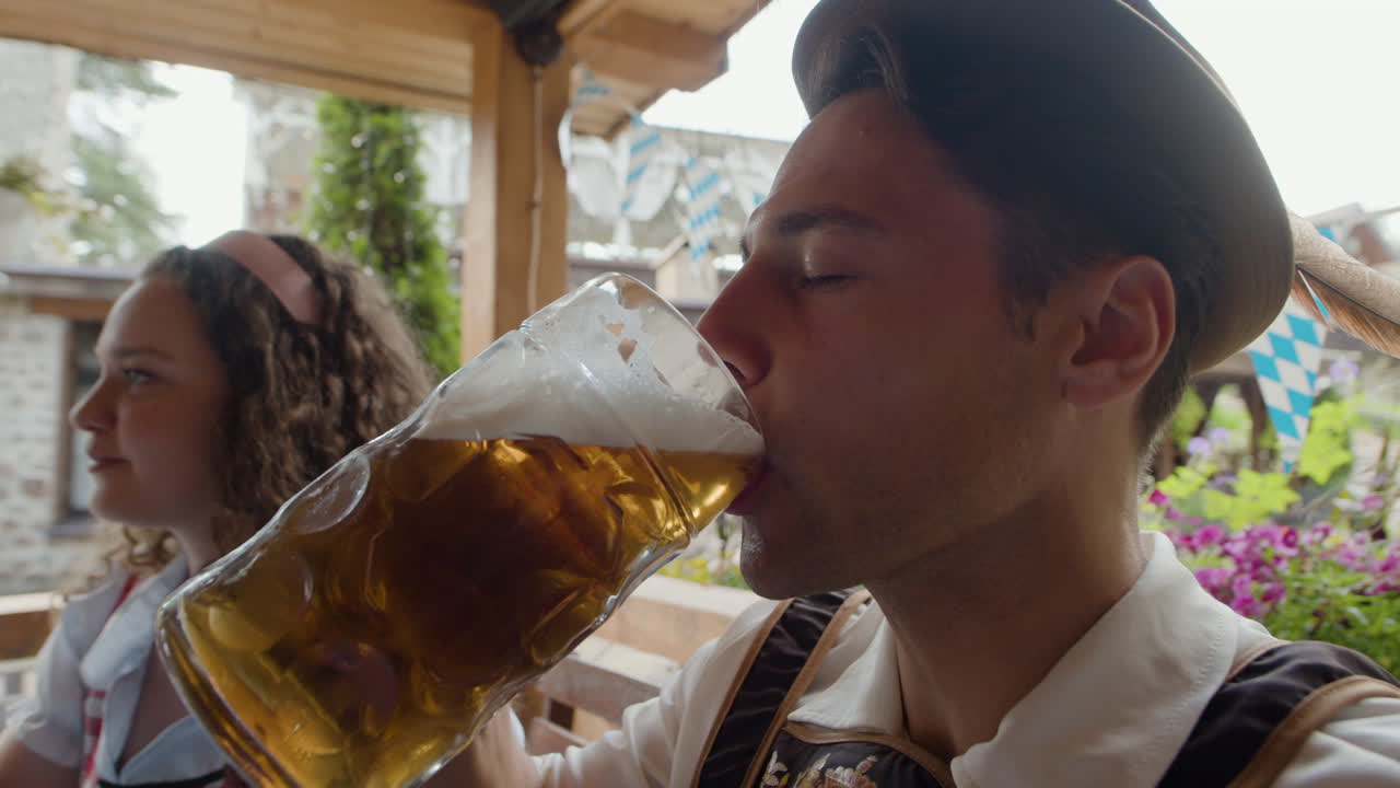 People in traditional clothing drinking beer