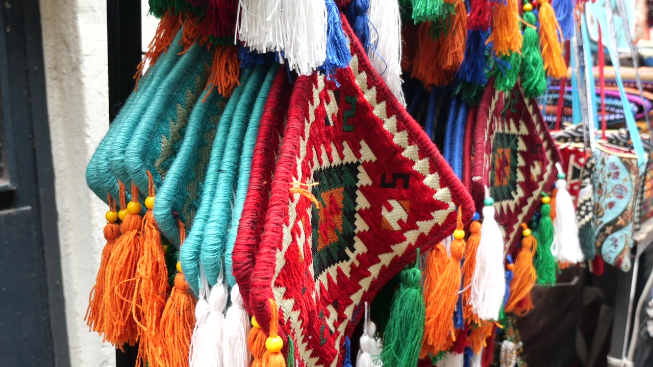 Close-Up of Traditional Colorful Woven Bags with Tassels
