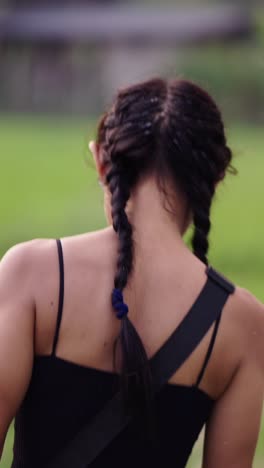 woman with braids in a field