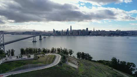 a smooth horizontal drone push-in shot towards the bay bridge from yerba buena island, ca