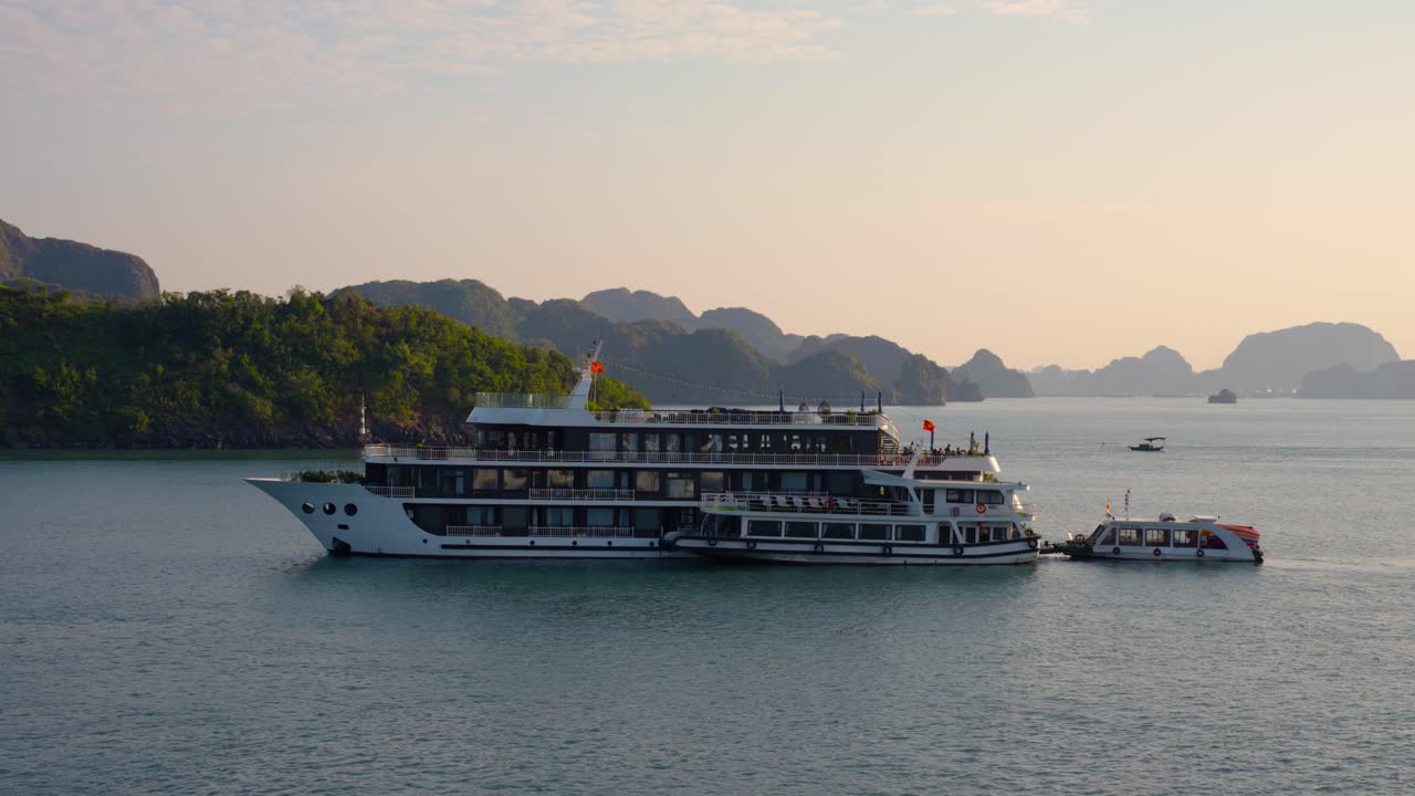 Touristic Cruise Ship Cruising at Halong Bay During Amazing Sunrise, Vietnam