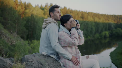 couple taking pictures in nature