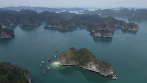 drone shot of jagged island cliffs in cat ba and halong bay in northern vietnam