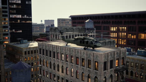 military helicopter on rooftop of a city