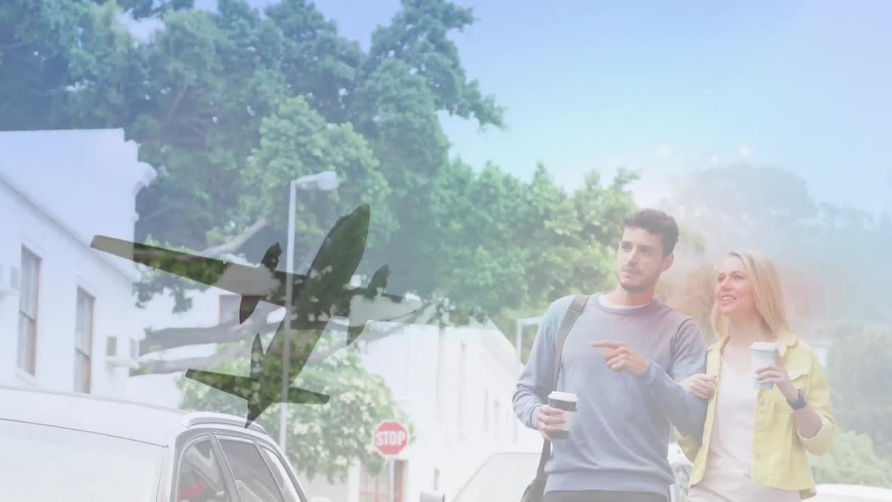 路上で歩いている白人カップルの飛行機のビデオ