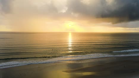 sun rising at beach in a calm morning