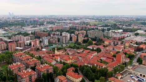 dynamic aerial approaching rural area outside central milan, italy