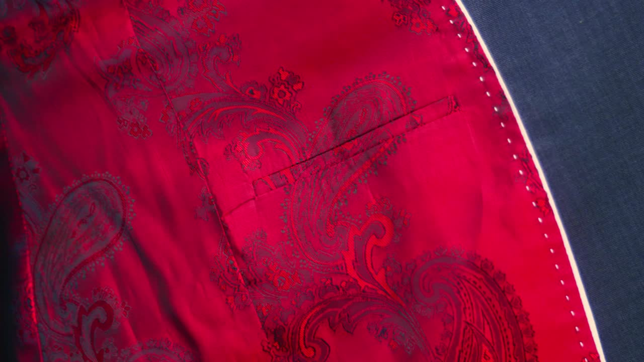 4K Cinematic fashion clothing footage of the inside of a beautiful handmade suit in a tailor's shop