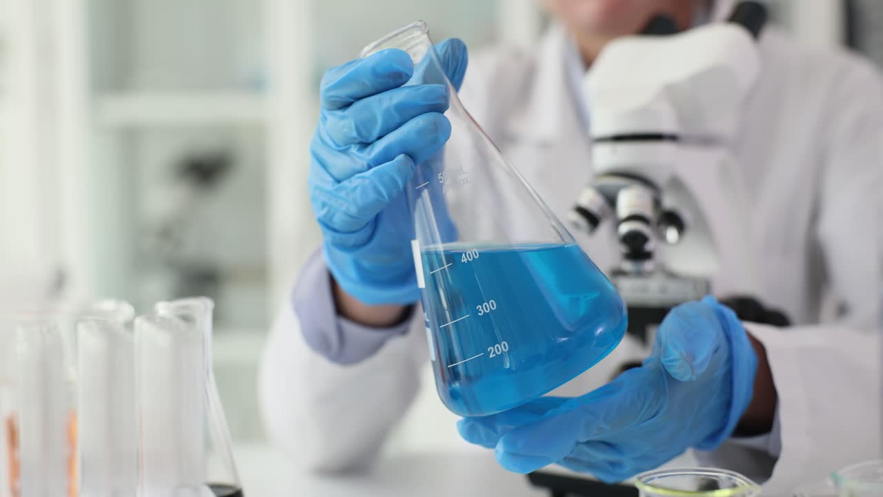 A scientist conducting a chemical experiment in a laboratory
