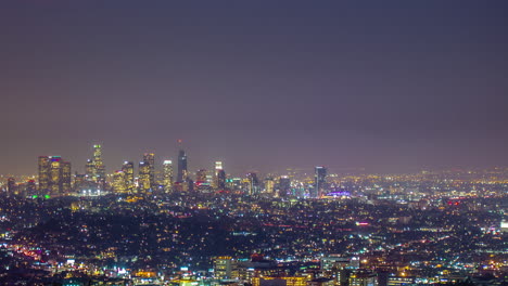 the los angeles city skyline at night - time lapse