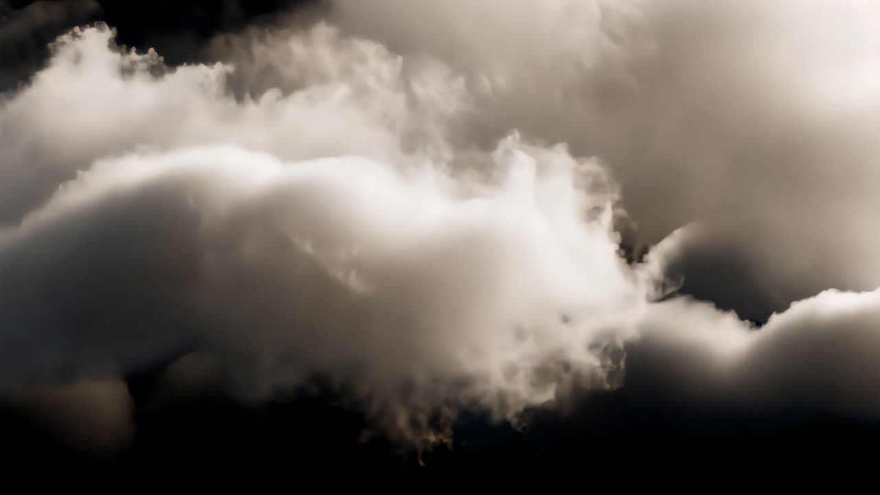 Dramatic clouds against darkness animated overlay, transparent 4K video, alpha channel, ProRes 4444