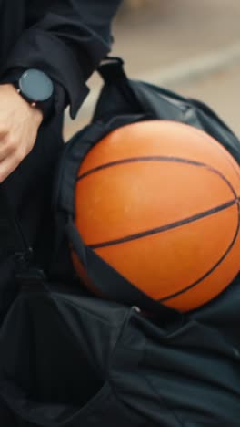 person carrying basketball backpack